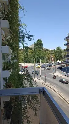 a view of a city street with cars on the road at Penth3 in Athens