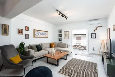 a living room with a couch and a table at Zen Spring, Neapoli in Athens