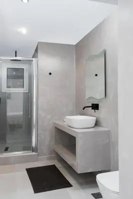 a bathroom with a sink and a shower and a toilet at Zen Spring, Neapoli in Athens