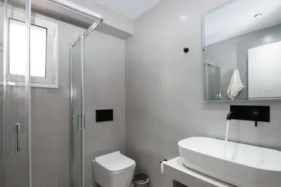 a bathroom with a sink and a toilet and a shower at Zen Spring, Neapoli in Athens