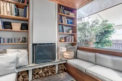 a living room with a fireplace and a couch at Boutique Loft Penthouse in Athens
