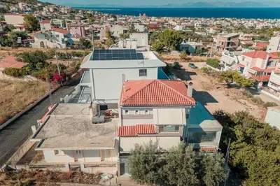 an aerial view of a house with solar panels on it at Aegean escape house in Artemida