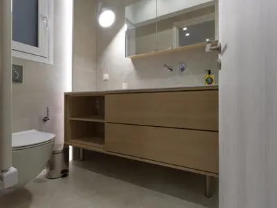 a bathroom with a sink and a toilet at Chic and modern apartment in the center of Kolonaki in Athens