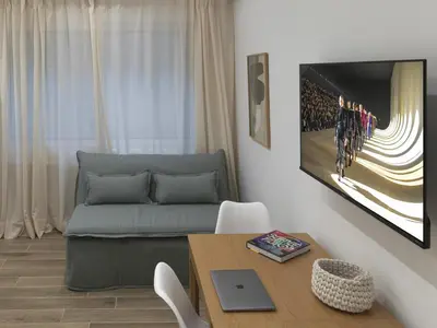 a living room with a couch and a table at Chic and modern apartment in the center of Kolonaki in Athens