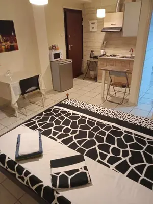 a kitchen with a black and white rug on the floor at Athens Koukaki - Metro station Sygrou-Fix closer in Athens