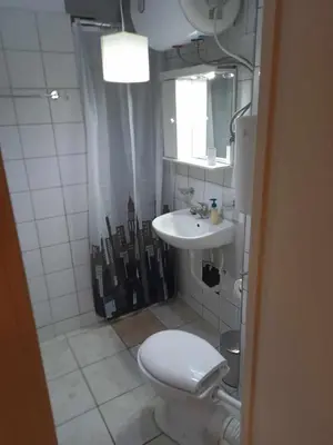 a bathroom with a toilet and a sink at Athens Koukaki - Metro station Sygrou-Fix closer in Athens