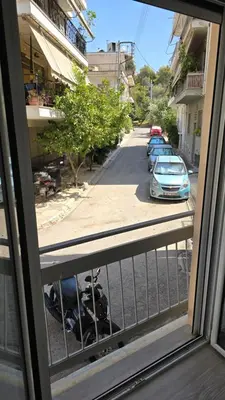 a view of a street from a window at Ovelix apartment in Athens