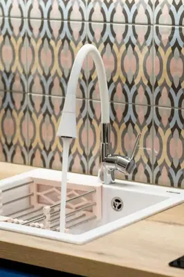 a white kitchen sink with a faucet at Piraeus Marina Haven 1 in Piraeus