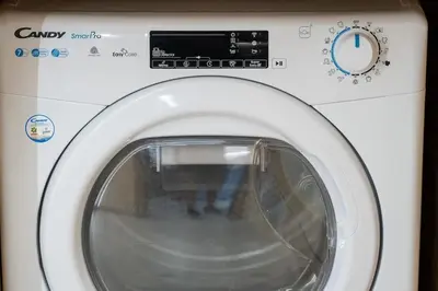 a white washing machine with its door open at Piraeus Marina Haven 1 in Piraeus