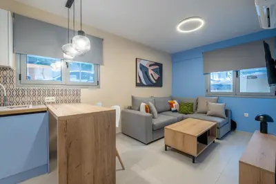 a living room with a couch and a table at Piraeus Marina Haven 2 in Piraeus