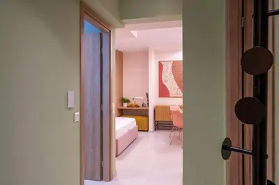 a bedroom with a bed and a room with a desk at Piraeus Marina Haven 3 in Piraeus