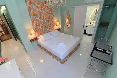 a small bedroom with a bed and a bathroom at Warm & cozy studio - apartment 1 in Athens