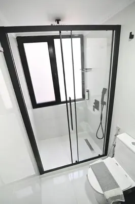 a bathroom with a glass shower and a toilet at Warm & cozy studio - apartment 1 in Athens