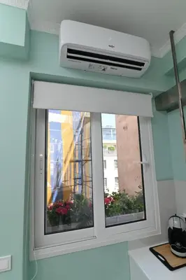 a window in a room with a air conditioner at Warm & cozy studio - apartment 1 in Athens