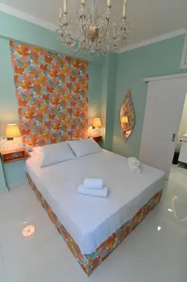 a bedroom with a bed with two towels on it at Warm & cozy studio - apartment 1 in Athens