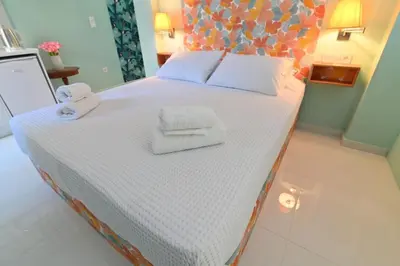 a bedroom with a bed with towels on it at Warm & cozy studio - apartment 1 in Athens
