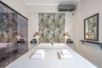 a bedroom with two beds with towels on them at Warm & cozy studio - apartment! #9 in Athens