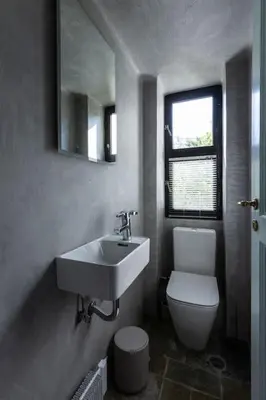 a bathroom with a sink and a toilet and a mirror at Danae's Art in Athens