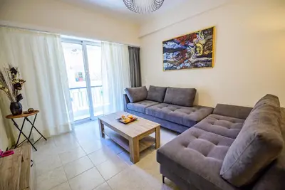 a living room with a couch and a table at Ser House in Athens