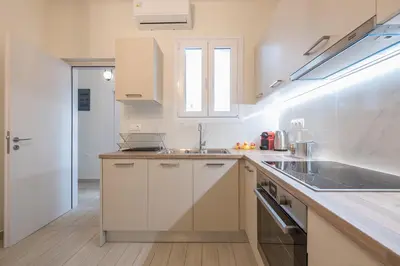 a kitchen with a sink and a counter top at Petralona Gem with Private Terrace in Athens
