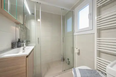 a bathroom with a shower and a sink at Petralona Gem with Private Terrace in Athens