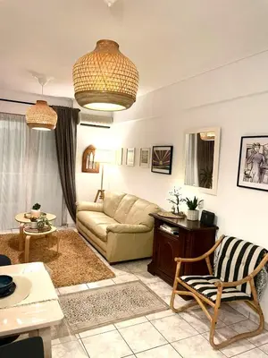 a living room with a couch and a table at Artemis sea house in Porto Rafti