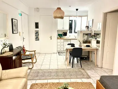 a kitchen and living room with a table and chairs at Artemis sea house in Porto Rafti