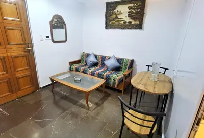 a living room with a couch and a table at 1\u53f7\u6c11\u5bbf in Athens