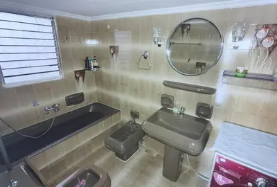 a bathroom with a sink and a tub and a mirror at 1\u53f7\u6c11\u5bbf in Athens