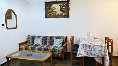 a living room with a couch and a table at 1\u53f7\u6c11\u5bbf in Athens