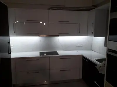 a white kitchen with white cabinets and a sink at Modern and comfortable apartment 5km from center in Athens