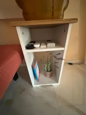 a small white shelf with a plant in it at Garden Vibes Glyfada in Athens