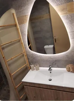 a bathroom with a sink and a mirror at Island 3siblings in Athens