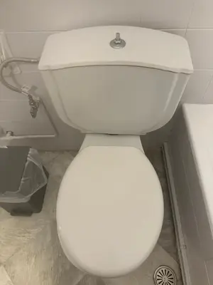 a bathroom with a white toilet in a room at Spartan Residence in Athens
