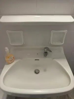 a white sink with a faucet in a bathroom at Spartan Residence in Athens