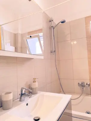 a bathroom with a sink and a shower at Aegean Pearl in Porto Rafti