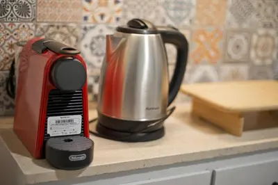 a coffeemaker and a tea kettle on a counter at Hill House Lycabettus Stylish near Athens Center in Athens