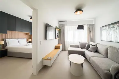 a living room with a couch and a bed at Stylish Comfort Apt in Athens Centre in Athens