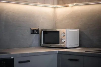 a microwave sitting on top of a counter at Stylish Comfort Apt in Athens Centre in Athens