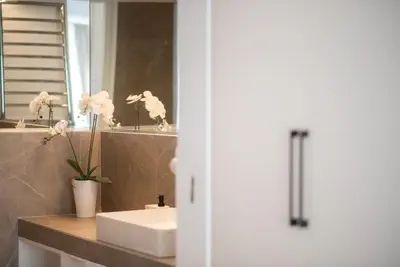 a bathroom with a sink and a mirror at Stylish Comfort Apt in Athens Centre in Athens