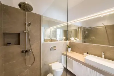a bathroom with a shower and a toilet and a sink at Stylish Comfort Apt in Athens Centre in Athens