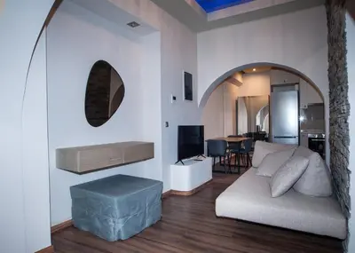 a living room with a couch and a table at Sia's Retreat 2 Modern Apt Athens Riviera in Athens