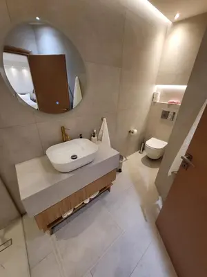 a bathroom with a sink and a mirror and a toilet at Villa Solaris in Sounio