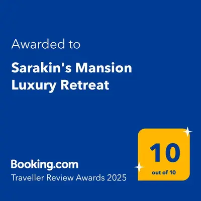 a yellow sign with the text awarded to saathis mansion luxury retreat at Sarakin's Mansion Luxury Retreat in Athens