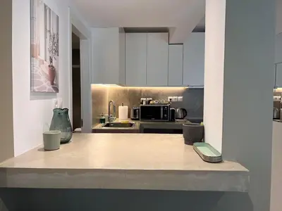 a kitchen with a counter with a phone on it at Diegos cozy Athens Apartment Walk to Acropolis in Athens