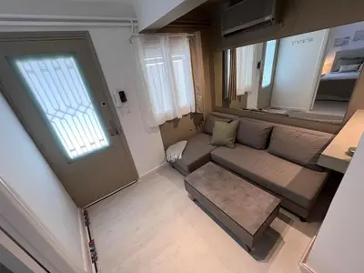 an overhead view of a living room with a couch at Diegos cozy Athens Apartment Walk to Acropolis in Athens