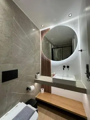 a bathroom with a sink and a mirror at BlueMotion - PortSuite 5B in Piraeus
