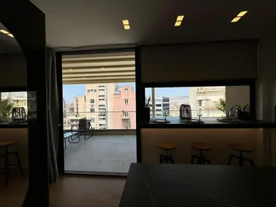 a room with a view of a balcony with stools at BlueMotion - PortSuite 5B in Piraeus
