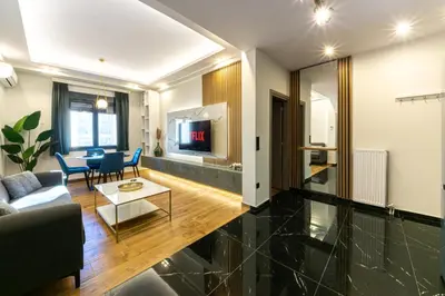 a living room with a couch and a table at Polis luxury apartment 4 in Athens