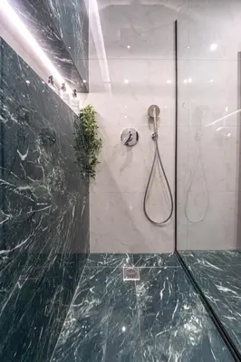 a bathroom with a shower with a glass wall at Polis luxury apartment 4 in Athens